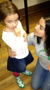 child is being guided to better hallway behavior by a teacher