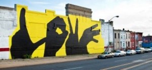 this large mural fronts a building on Broadway Ave.