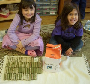 TNCS kindergartners proudly package their dimes to donate to Heifer International