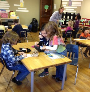 kids are hard at work together and independently, fully engaged in their reading, writing, and core math and science skills