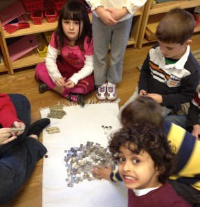 TNCS kindergartners all worked together to roll the thousands of dimes to donate to Heifer International