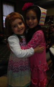 These friendly maidens grab a postdinner hug.