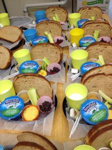 A typical lunch includes an organic dairy item or two, fruits, veggies, a home-baked item, and multi-grain  bread.