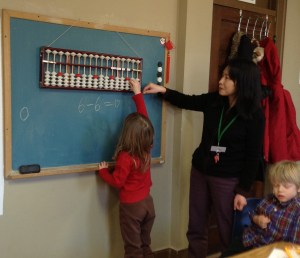 Lead pre-primary Mandarin teacher Lin Laoshi moonlights in the elementary class to teach the abacus. he is also a member of the prestigious Chinese American Abacus Association.