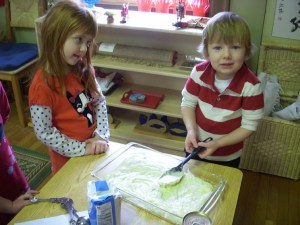 A younger student gets some pointed help from his older classmate.