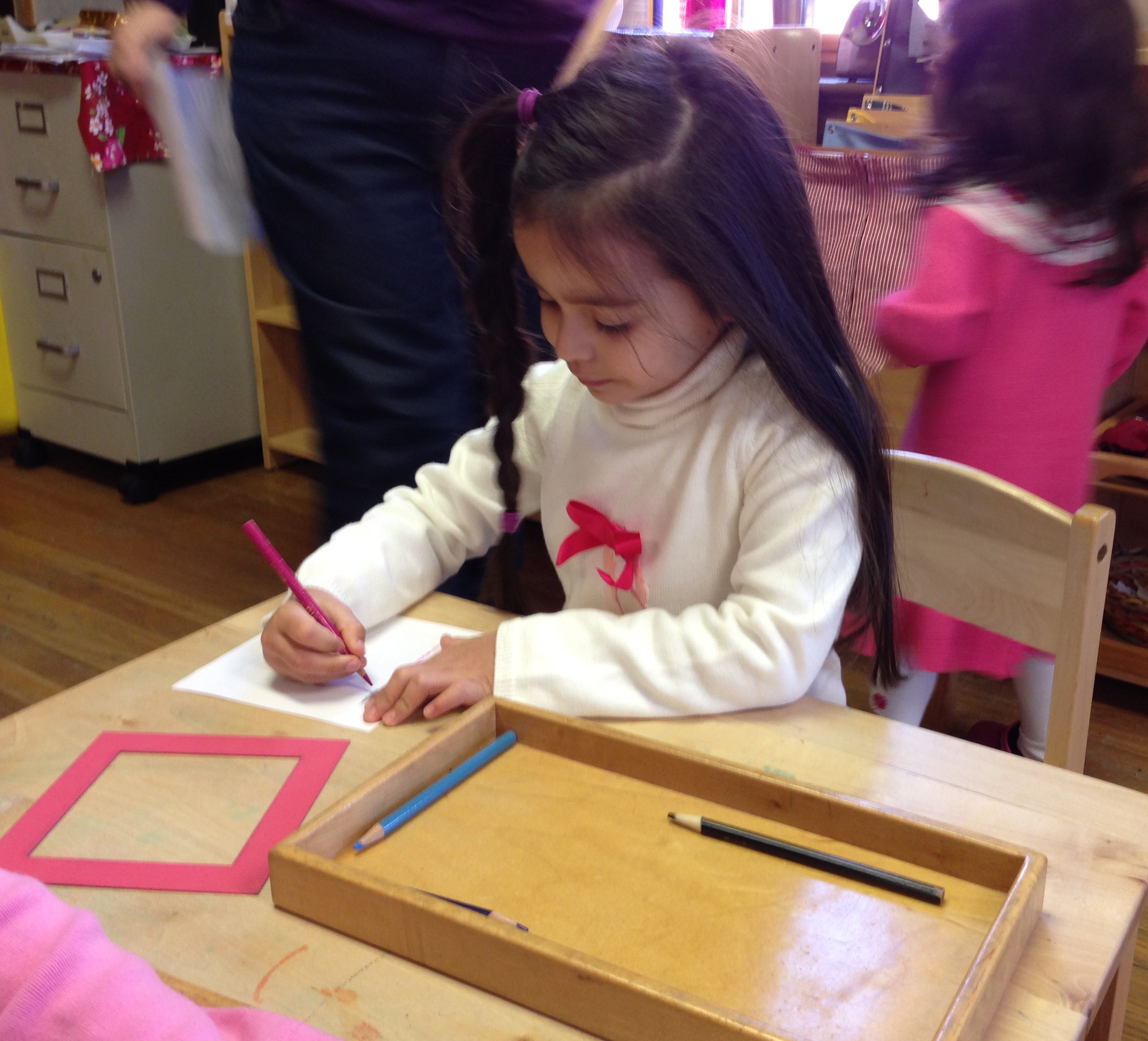 Working with the metal inset develops fine motor coordination