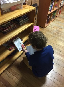 tncs-student-reads-from-school-library